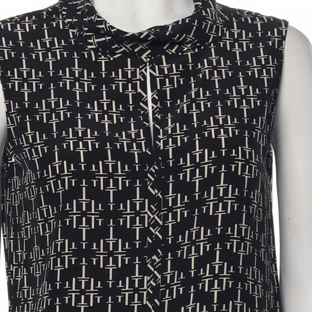 Tory Burch t logo sleeveless top. Never worn. Really nice!